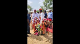 India's Tourism Minister and Rajasthan Chief Minister ride camel in Jodhpur
