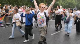 Paloma Faith laughs at Anti Gay protesters at the Pride Parade whilst Jesy Nelson hides from the rain under an inflatable