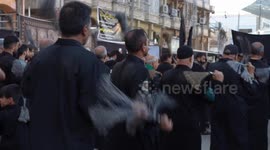 Iraq: Shiite Muslims beat themselves with chains during Muharram procession in Iraq's Najaf