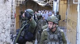 Israeli settlers march in Hebron under army escort amid tensions in W. Bank