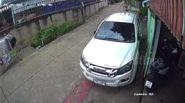 Unattended motorcycle rolls out and falls in Phayuha Khiri, Thailand