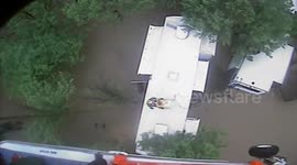 Helicopter crew rescue resident stranded on roof in Texas floods