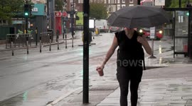 Vehicles make a splash during torrential rain ahead of heatwave in London