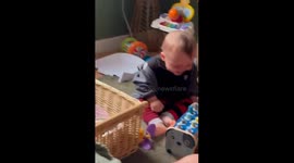 Adorable baby laughs uncontrollably while watching his favorite toys fly