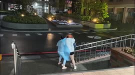 Nurses blown over during Typhoon Danas in Taiwan