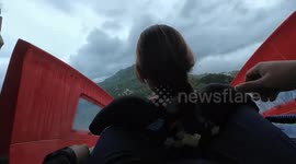 Tourists enjoy high-speed ride on waterslide in Thailand