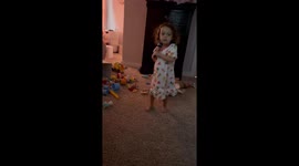 Little girl continues playing after ball taps her head in Reading, Pennsylvania, USA