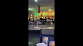 Friend attempts creative bowling shot in Mulhouse, France