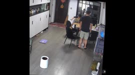 Child falls off chair while balancing in Hunan, China