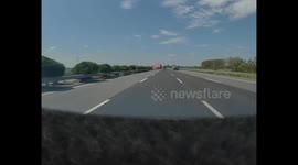 Truck loses control and flips, throwing man onto highway in Henan, China