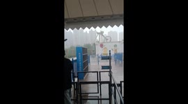 Holidaymakers drenched as giant pendulum ride swings back and forth in rain