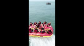 Tourist regrets choosing middle seat on inflatable when he's dumped into the sea