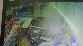 Underage driver crashes into parent-and-baby store in China narrowly missing man holding child