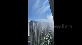 'Artificial rainfall' sprayed from high-rise buildings to combat scorching heat in China