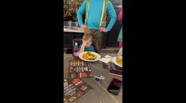 Little boy has head in hands as restaurant staff dressed as Trolls sing 'Happy Birthday'