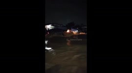 Floods surge through hospital forcing patients to be evacuated in Indonesia