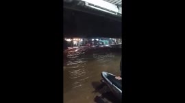 Motorists stranded as flood surges through roads in Indonesia