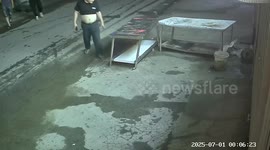 Chubby man breaks table when he leans on it outside shop