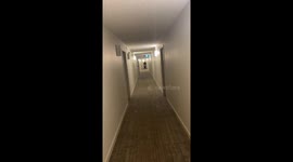 Grandma with cancer takes grandson for a ride down the hallway in her wheelchair