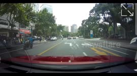 Reversing car causes rear-end collision at stoplight in Shanghai, China