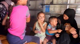 A Palestinian child weeps in pain inside an ambulance