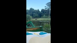 Sled Skids Across Water Pulled by ATV
