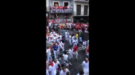Bull charges through street on third day of Pamplona festival