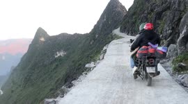 Motorcycle riders navigate terrifying 6,000ft high narrow road