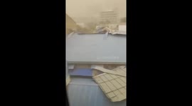 Terrifying moment strong wind uprooted roof and blow onto resident's balcony