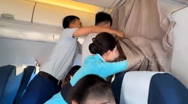 Cabin crew wrestle with fans trying to reach pop star in business class