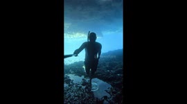 selfie video walking upsidedown in a flooded cave with air pockets