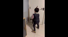 A Boy Plays With the Tabby