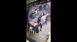 Bucket of Beer Sprays in Restaurant