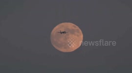 US: Full moon rises over San Francisco Bay creating dramatic visual scene