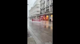 Advertising board blown down street by storm in China