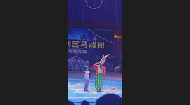 Boy Imitates Clown's Movements