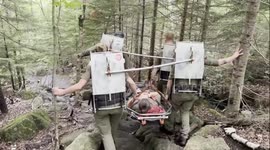 US: Forest Rangers Carry Injured Hiker Down Mount Jo on Litter