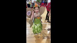 Toddler wears dress made of vegetables for Nutrition Month