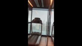 Storm flings deckchairs across pool on 40th floor of apartment tower