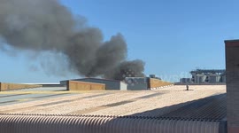 Plume of dark smoke rises from fire in industrial area Rochester