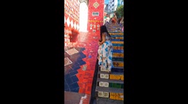 Little girl slips into gutter during playful stair slide in Rio de Janeiro, Brazil