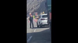 Falling rock hits excavator during roadwork in Arica, Chile