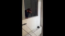 Man rescues kitten with dustpan from ledge in Johor, Malaysia