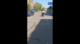 Scooter drifts sideways on city road in Jilin, China