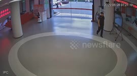 Car crashes through glass entrance of building in Guangdong, China