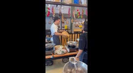 Hilarious moment tourist tries to toss sticky rice but drops it on friend