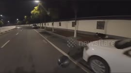 A Man Chases His Dog on Motorcycle