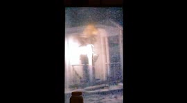 This was recorded back in December frome my living room where I have my outside camera facing my front Door I kept on seeing something move on screen outta the corner of my eyeand it appears to be a large being looking in my front door with a little femal
