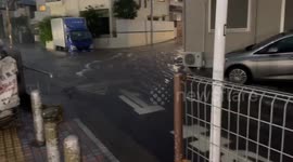 Heavy Rain Turns Tokyo Streets Into Rushing Streams
