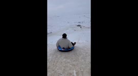 A Man Slides Down the Hill